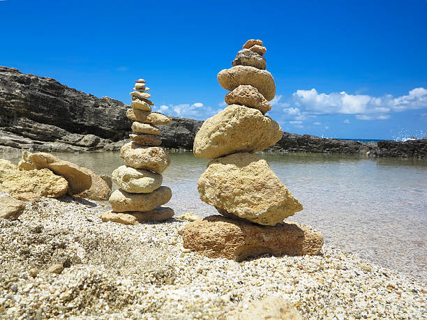 istock Piramide stack of zen stones near sea and blue sky 484552246