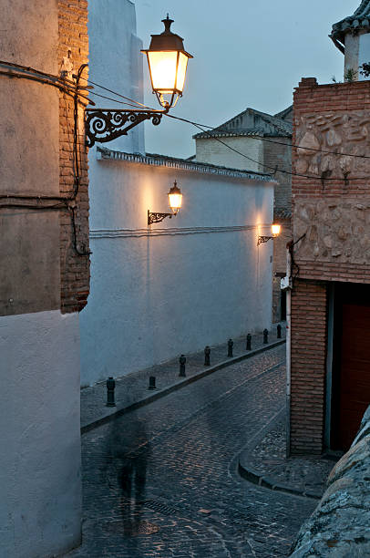 Narrow street in Granada's Albaicin quarter stock photo