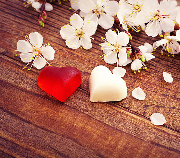 istock Wedding rings. Spring. Flowering branch on wooden surface 484554296