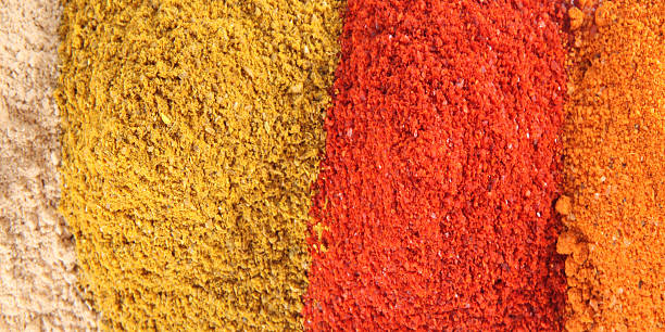 istock Various colourful spices of india close up  background 484556396