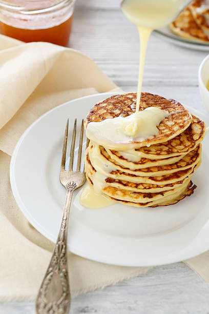 istock Stack of pancakes with condensed milk 484557396