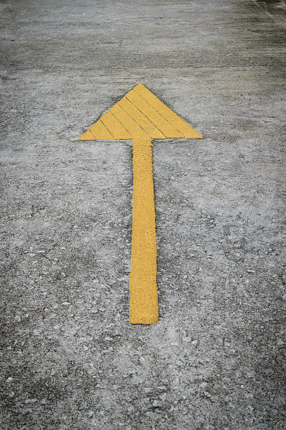 istock Forwarded yellow arrow on the road 484557812