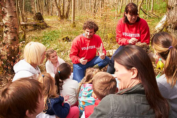 Photo of Adults And Children Examining Bird's Nest At Activity Centre