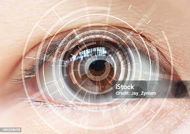 Closeup Of Womans Brown Eye High Technologies In The Future Stock Photo - Download Image Now
