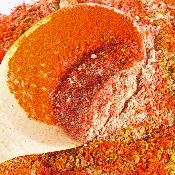 istock Colorful spices with wooden spoon background 484558546