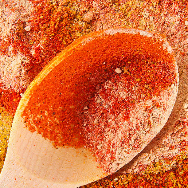 istock Colorful spices with wooden spoon background 484558572