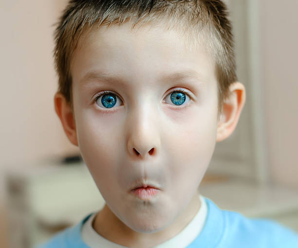 istock boy with a look of surprise 484561973