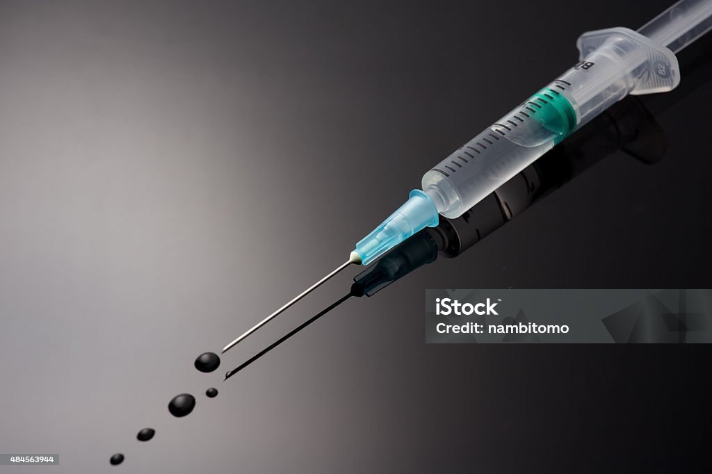 medical syringe with solution drop medical syringe with injection solution drop 2015 Stock Photo