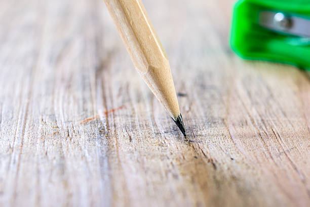 istock pencils on wood background 484564374