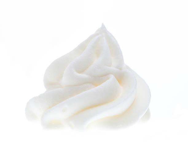 Whipped cream isolated on white background stock photo