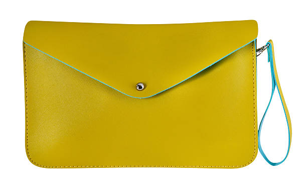 Yellow leather purse Woman's yellow purse isolated on white clutch bag stock pictures, royalty-free photos & images