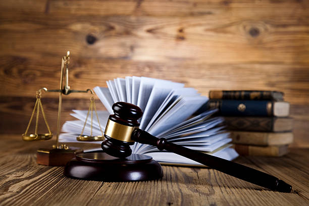 istock Wooden gavel and books 484565523