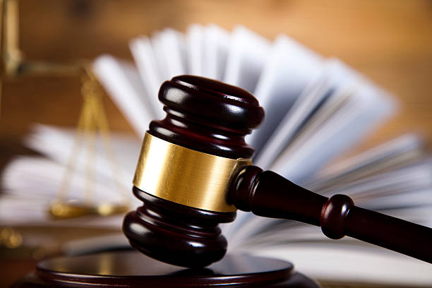 istock Wooden gavel and books 484565531