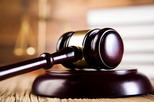 istock Wooden gavel and books 484565583