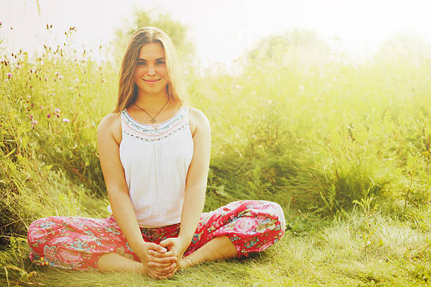 istock Woman doing yoga in grass. 484565718