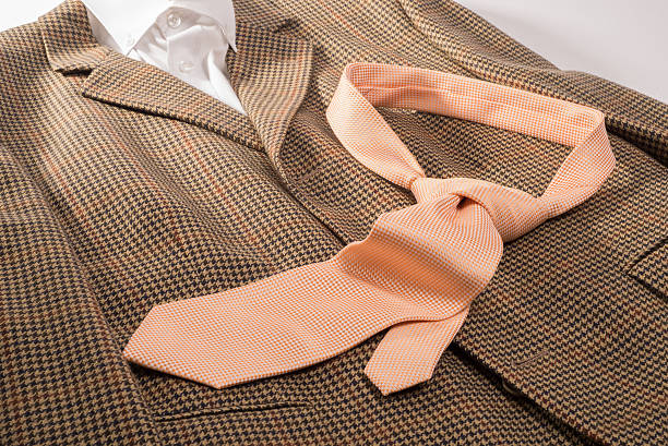 istock Orange Tie on Brown Jacket and White Shirt 484566290