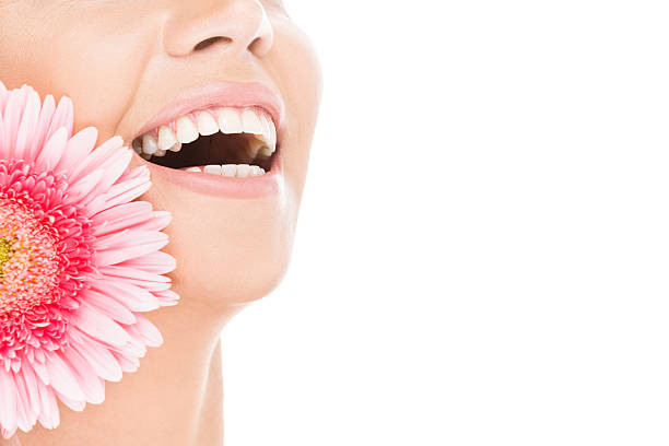 Girl sniffing the scent of flowers