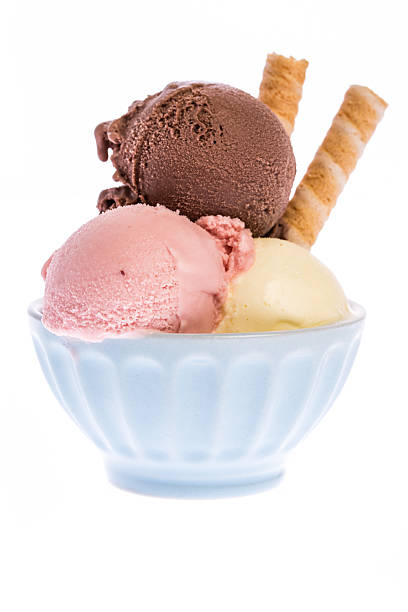 Three scoops of ice cream in blue china