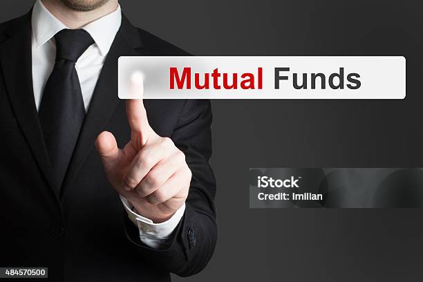 Businessman Pushing Touchscreen Button Mutual Funds Stock Photo - Download Image Now