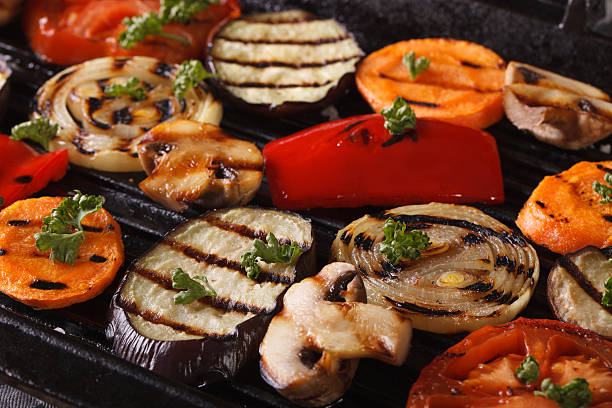 istock vegetables cooked in a black skillet grill macro. horizontal 484570978