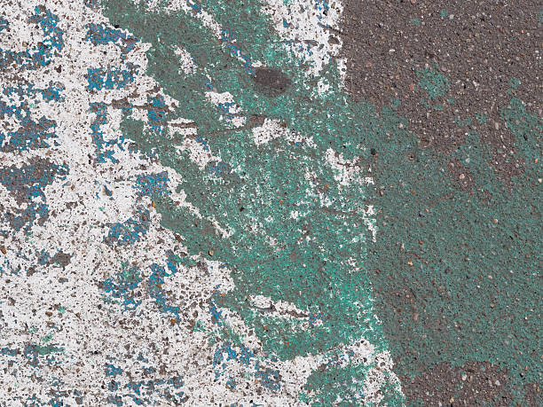 istock painted asphalt interspersed with gravel 484571392