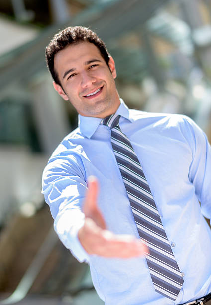 istock Business man giving a handshake 484571738