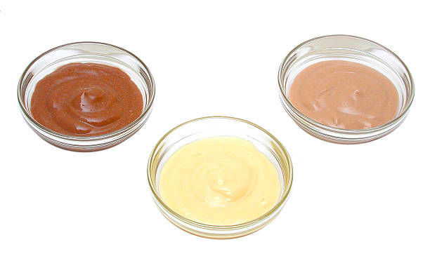 istock 3 varieties of pudding - chocolate, vanilla, strawberry 484572840