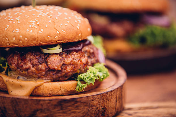 istock Big gourmet burger with fresh ingredients and prime beef patty 484574234