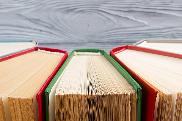 istock Top view of old used colorful hardback books. 484574668