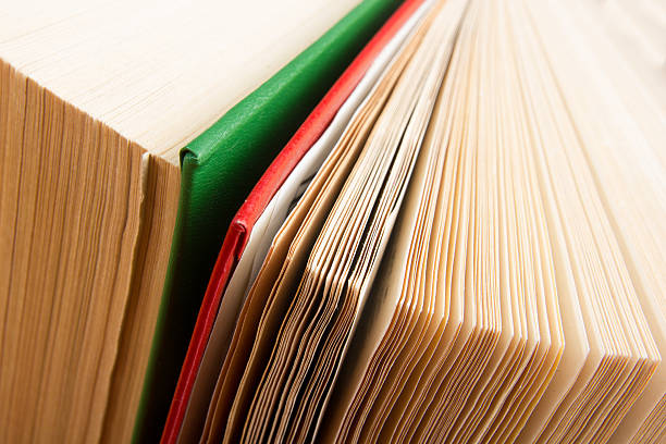 istock Top view of old used colorful hardback books. 484574798