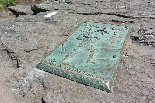 Dahlonega, Georgia, United States - May 2, 2015: A copper plaque marks the beginning (or end) of the famed Appalachian Trail