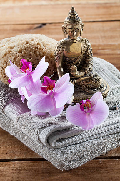 natural accessories for beauty treatment still-life with zen mindset Buddha for spirituality at beauty spa with sponge flower massage and ritual accessories buddha image stock pictures, royalty-free photos & images