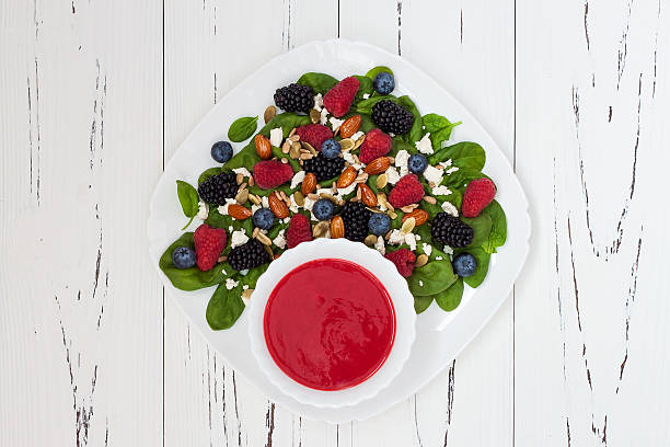 istock Mixed berry salad with almonds, feta cheese and raspberry vinaigrette 484575776