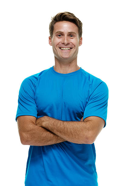 istock Smiling man standing with arms crossed 484576086