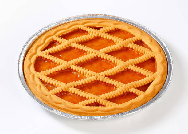 Linzer apricot tart Lattice topped apricot tart in tin foil pan crostata photos stock pictures, royalty-free photos & images