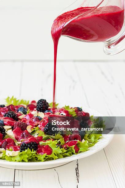 Green Mixed Berry Salad With Seeds Blue Cheese And Almonds Stock Photo - Download Image Now