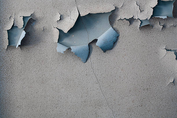 Paint peeling on an old plaster wall Paint peeling on an old plaster wall peeled photos stock pictures, royalty-free photos & images