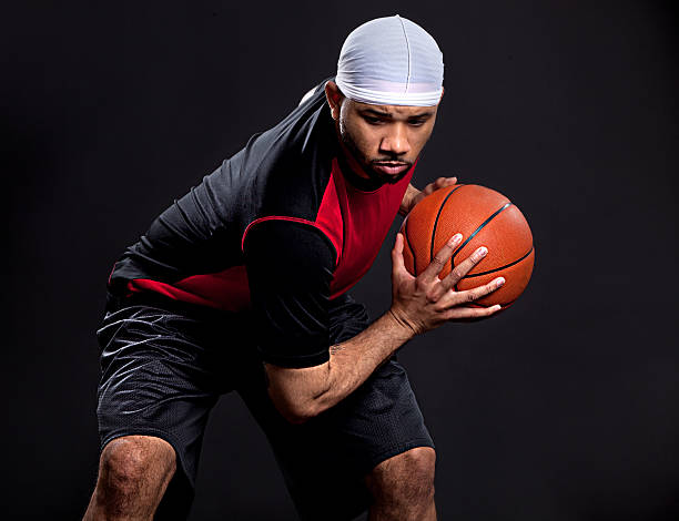 Basketball Player A young man playing basketball. do rag stock pictures, royalty-free photos & images