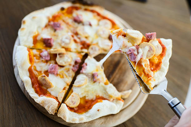 istock Take out sausage pizza from chef.  Ready to serve. 484579019