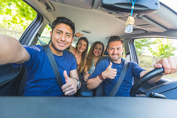 istock Group of friends taking a selfie into the car 484579394