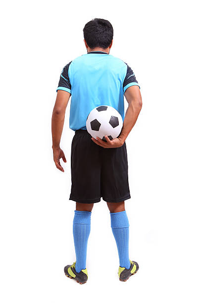 istock Young soccer football player on white 484579459