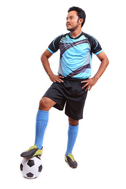 istock Young soccer football player on white 484579469
