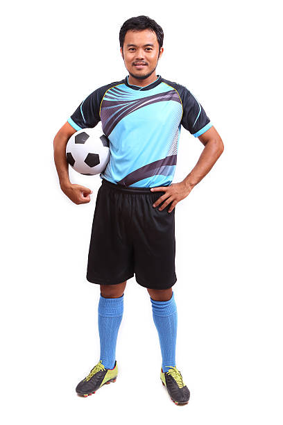 istock Young soccer football player on white 484579479