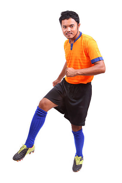 istock Young soccer football player on white 484579487
