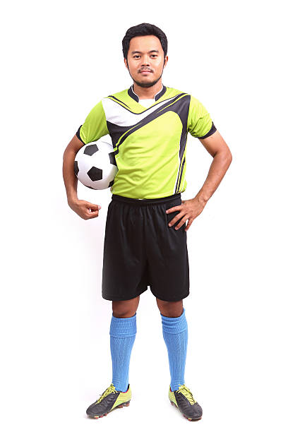 istock Young soccer football player on white 484579673