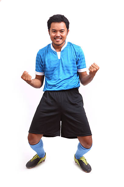 istock Young soccer football player on white 484579719