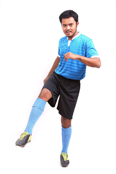 istock Young soccer football player on white 484579727