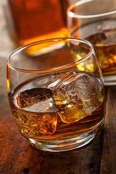 istock Alcoholic Whiskey Bourbon in a Glass with Ice 484581295