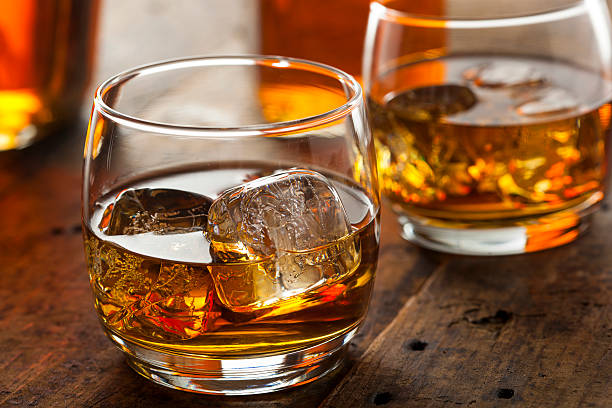 istock Alcoholic Whiskey Bourbon in a Glass with Ice 484581301