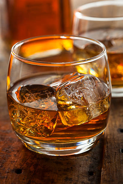 istock Alcoholic Whiskey Bourbon in a Glass with Ice 484581307